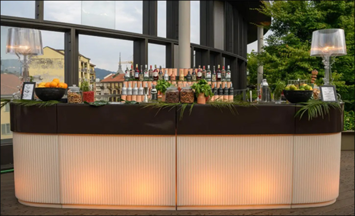 Chic corner lit bar furniture for rent, from Desert River's collection, ideal for events and gatherings in Dubai.